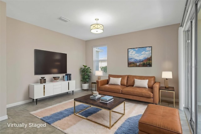 13619 Hunters Point St, Spring Hill, FL 34609 - living area featuring visible vents and baseboards
