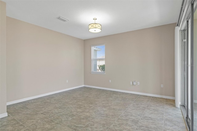 13619 Hunters Point St, Spring Hill, FL 34609 - spare room featuring baseboards and visible vents