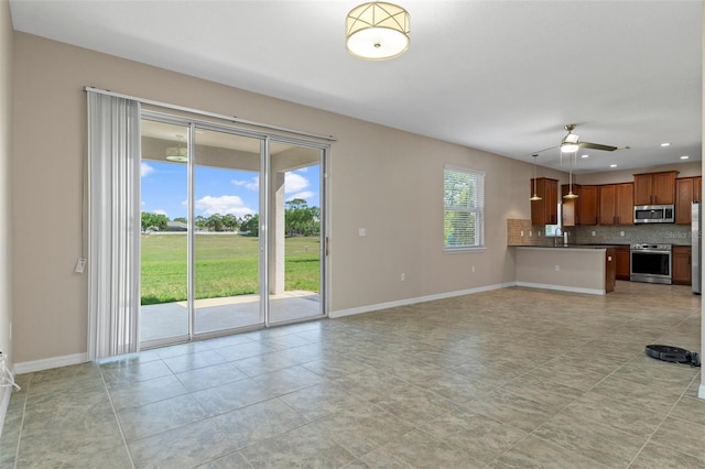 13619 Hunters Point St, Spring Hill, FL 34609 - unfurnished living room with light tile patterned floors, a ceiling fan, recessed lighting, a sink, and baseboards