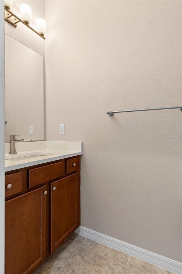 13619 Hunters Point St, Spring Hill, FL 34609 - bathroom featuring baseboards and vanity