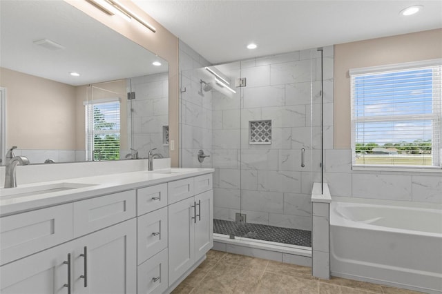 13619 Hunters Point St, Spring Hill, FL 34609 - full bathroom featuring a sink, tile patterned floors, a shower stall, and a garden tub
