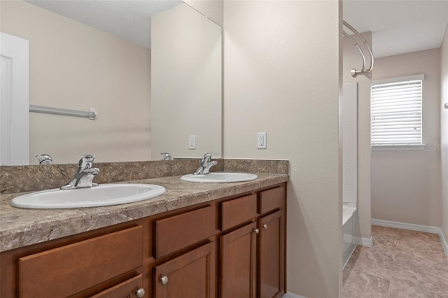 13619 Hunters Point St, Spring Hill, FL 34609 - full bathroom featuring double vanity, a sink, and baseboards