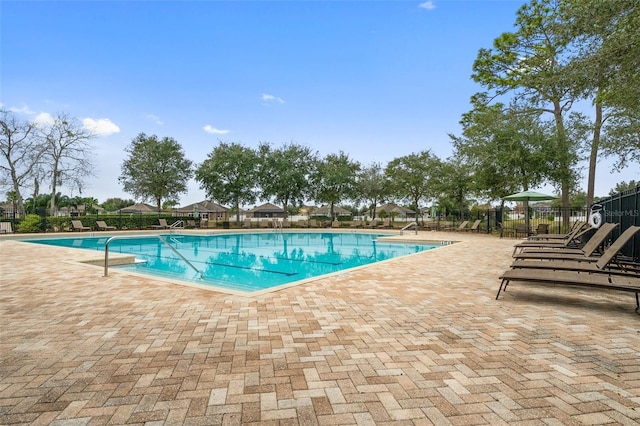 13619 Hunters Point St, Spring Hill, FL 34609 - community pool featuring a patio area and fence