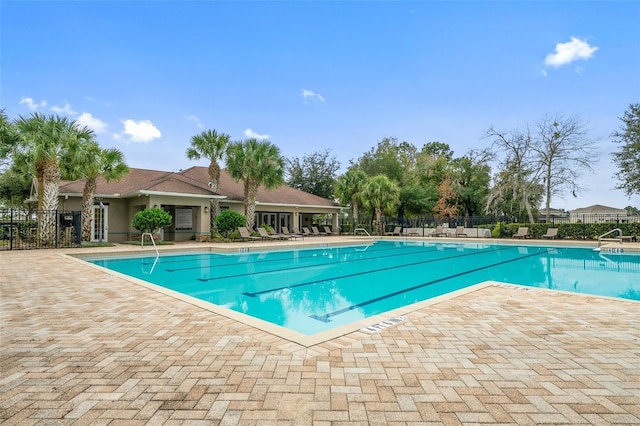 13619 Hunters Point St, Spring Hill, FL 34609 - community pool with a patio area and fence