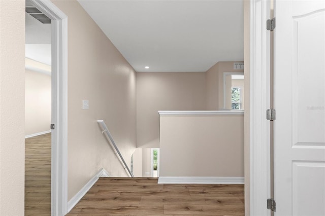 13619 Hunters Point St, Spring Hill, FL 34609 - hall with baseboards, recessed lighting, an upstairs landing, visible vents, and wood finished floors