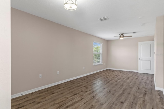 13619 Hunters Point St, Spring Hill, FL 34609 - spare room with light wood-style floors, baseboards, a ceiling fan, and visible vents