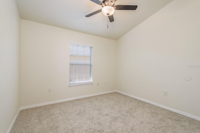spare room with carpet, ceiling fan, and baseboards