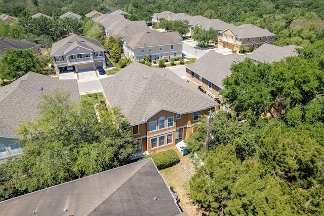 aerial view of residential area featuring a heavily wooded area