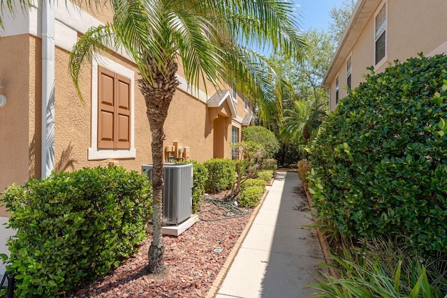 view of property exterior featuring stucco siding and cooling unit