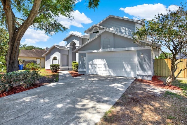 10423 Ashley Oaks Dr, Riverview, FL 33578 - view of front facade with fence, a garage, and concrete driveway