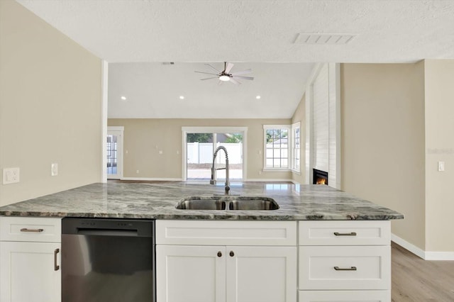 10423 Ashley Oaks Dr, Riverview, FL 33578 - kitchen featuring stone counters, open floor plan, stainless steel dishwasher, and a sink