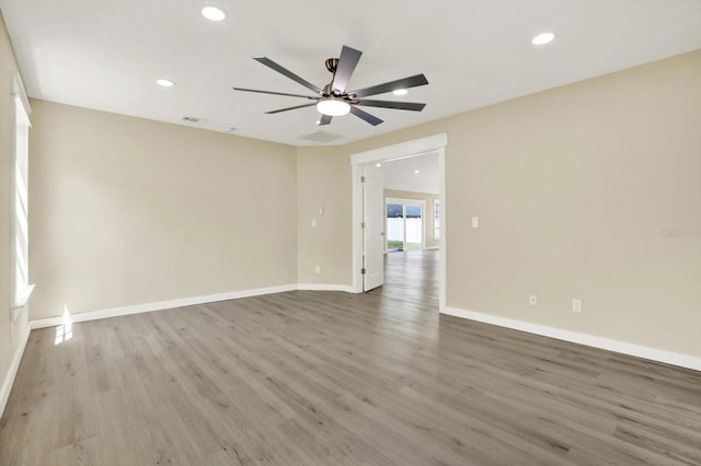 10423 Ashley Oaks Dr, Riverview, FL 33578 - unfurnished room with baseboards, wood finished floors, and visible vents