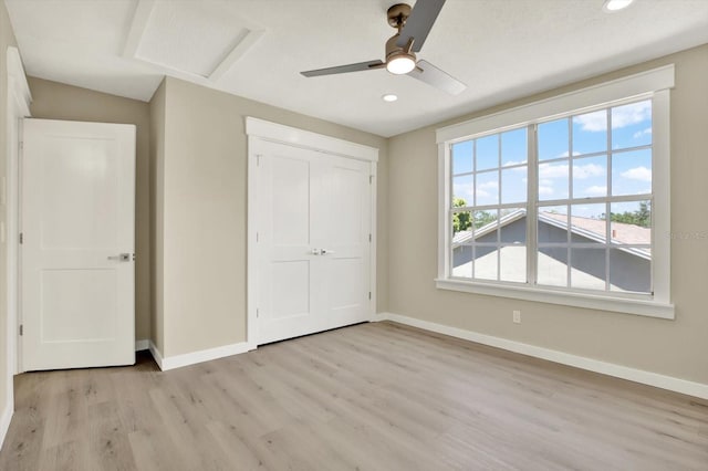 10423 Ashley Oaks Dr, Riverview, FL 33578 - unfurnished bedroom with recessed lighting, light wood finished floors, baseboards, and attic access
