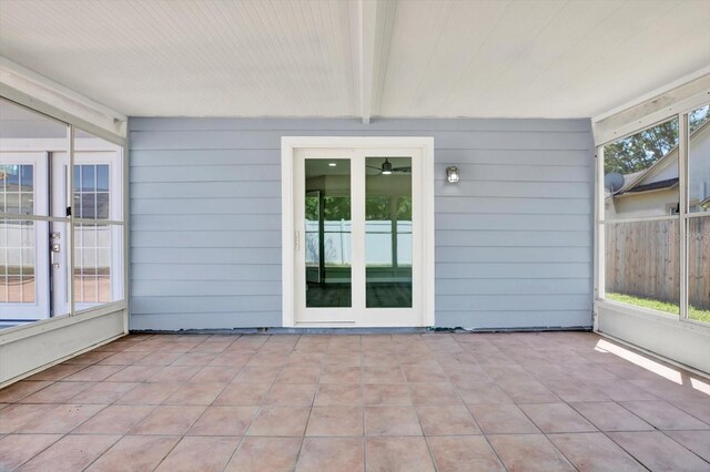 10423 Ashley Oaks Dr, Riverview, FL 33578 - unfurnished sunroom featuring french doors and beamed ceiling