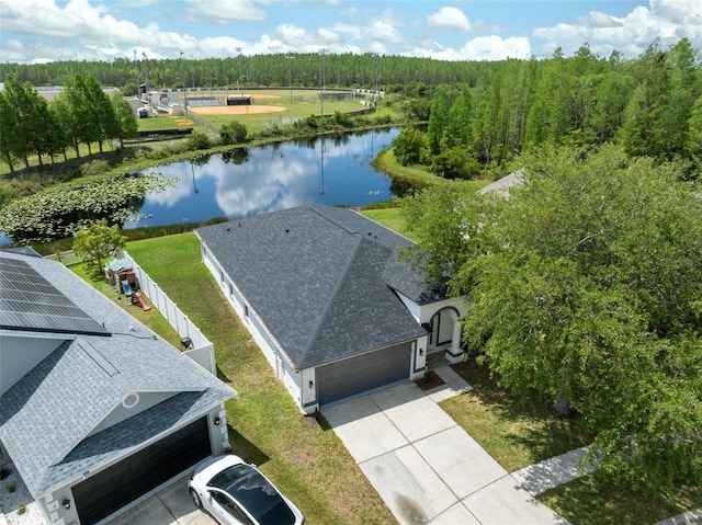 bird's eye view with a water view and a forest view