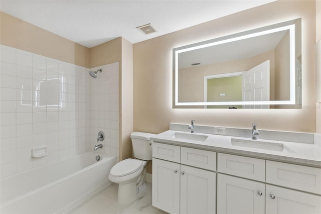 full bath featuring a sink, visible vents, toilet, and double vanity