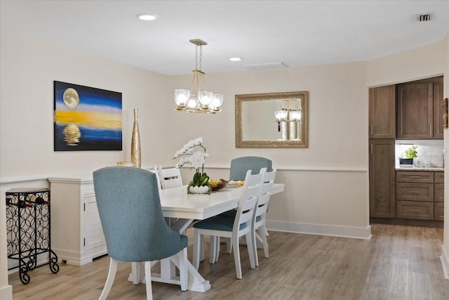 5033 Cabrilla Ct, New Port Richey, FL 34652 - dining space with a chandelier, light wood-style flooring, and recessed lighting