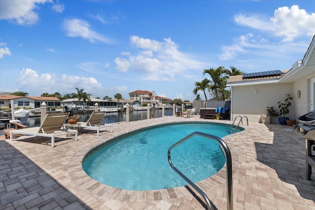5033 Cabrilla Ct, New Port Richey, FL 34652 - swimming pool featuring a patio area and a water view