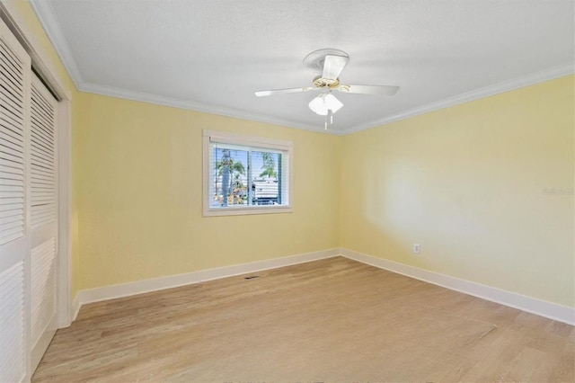 5033 Cabrilla Ct, New Port Richey, FL 34652 - unfurnished bedroom featuring light wood-style floors, a closet, ornamental molding, and ceiling fan