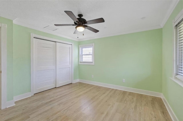 5033 Cabrilla Ct, New Port Richey, FL 34652 - unfurnished bedroom featuring light wood-type flooring, a closet, ornamental molding, and ceiling fan