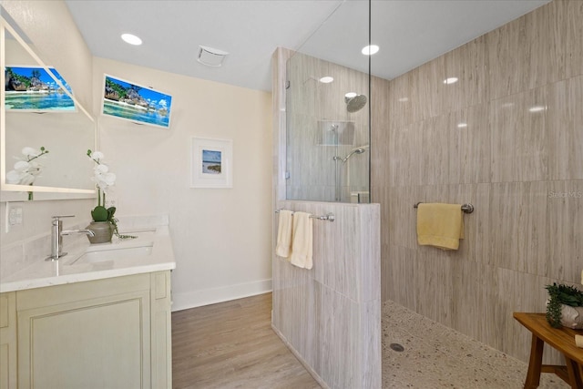 5033 Cabrilla Ct, New Port Richey, FL 34652 - full bathroom featuring a walk in shower, vanity, and wood finished floors