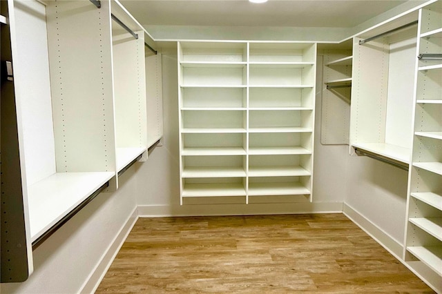 5033 Cabrilla Ct, New Port Richey, FL 34652 - walk in closet featuring wood finished floors