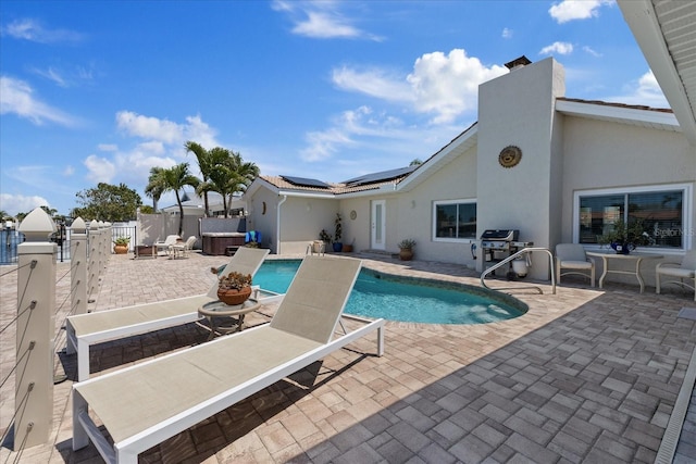 5033 Cabrilla Ct, New Port Richey, FL 34652 - view of swimming pool with a hot tub, a patio, a fenced backyard, and a grill