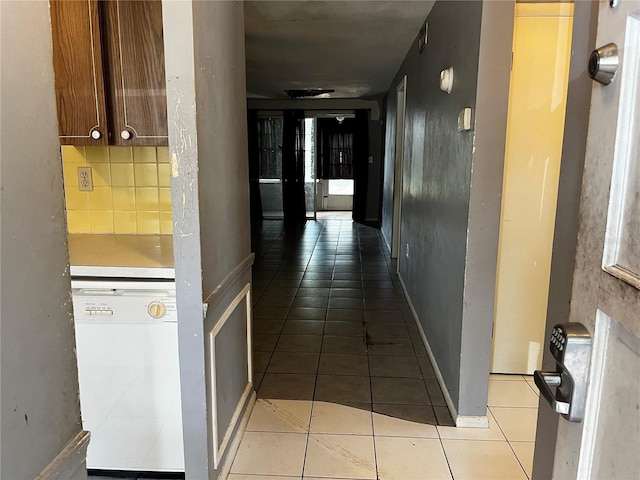 corridor with light tile patterned flooring