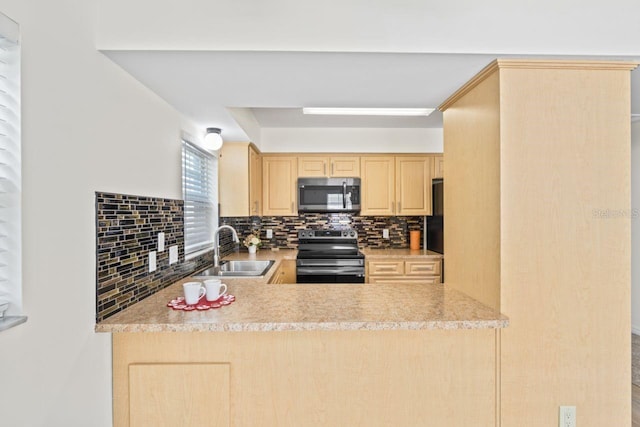 kitchen with a peninsula, light brown cabinetry, a sink, appliances with stainless steel finishes, and backsplash
