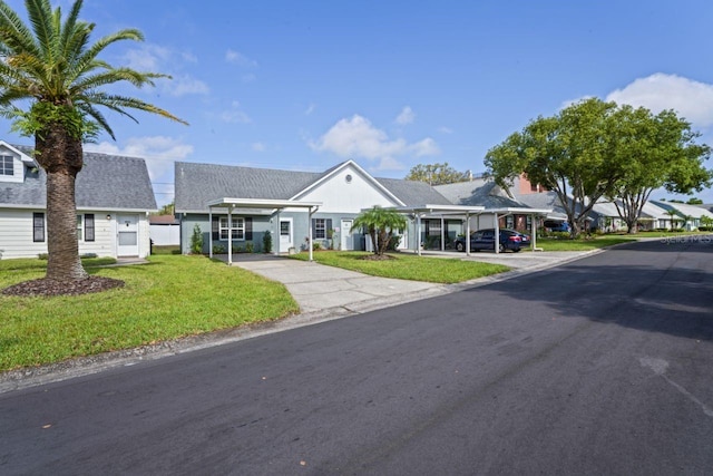 view of front of house with a residential view and a front yard