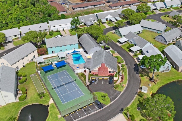 birds eye view of property with a residential view and a water view