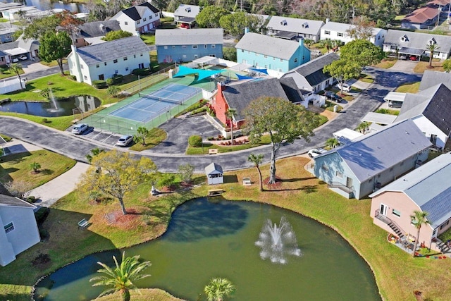 drone / aerial view with a residential view and a water view