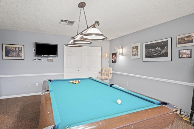 recreation room with a textured ceiling, visible vents, pool table, baseboards, and carpet floors