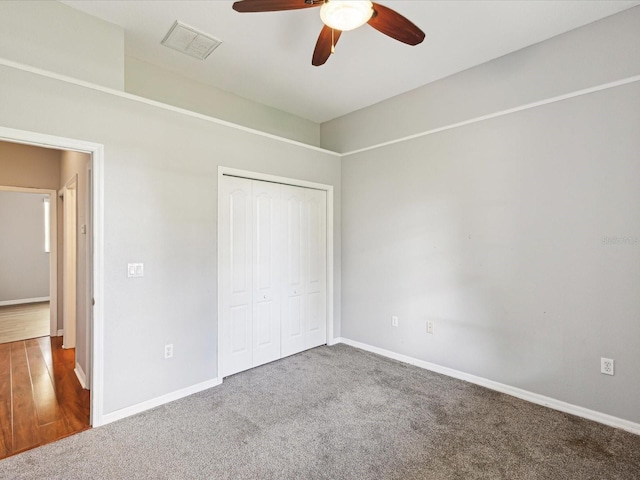 10318 Piper Dr, New Port Richey, FL 34654 - unfurnished bedroom with a closet, visible vents, carpet floors, and baseboards