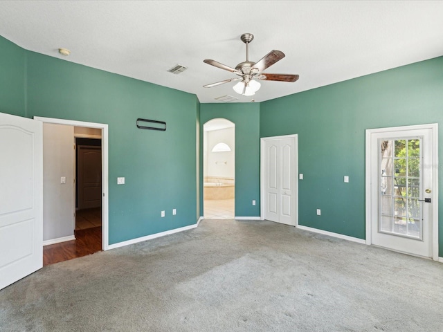 10318 Piper Dr, New Port Richey, FL 34654 - unfurnished bedroom with carpet, visible vents, connected bathroom, and baseboards
