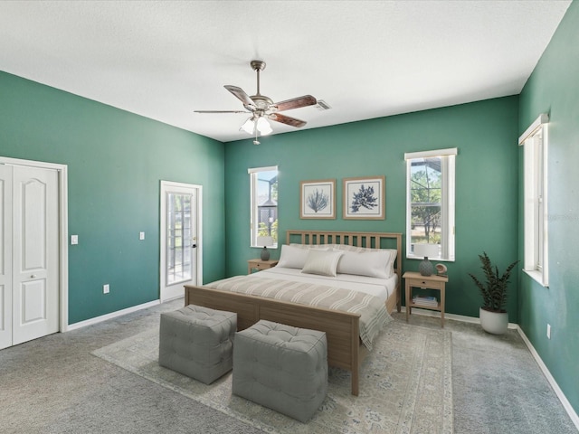 10318 Piper Dr, New Port Richey, FL 34654 - bedroom featuring multiple windows, ceiling fan, carpet floors, and baseboards