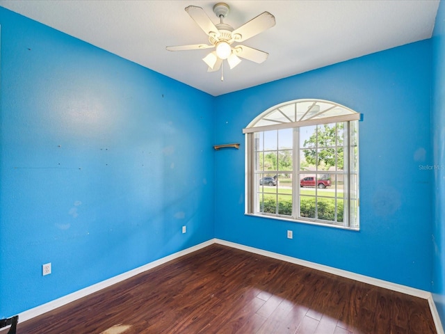 10318 Piper Dr, New Port Richey, FL 34654 - unfurnished room featuring ceiling fan, dark wood-style floors, and baseboards