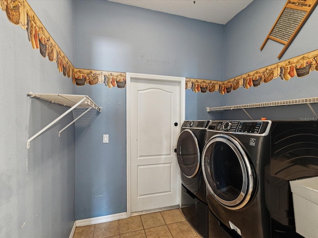 10318 Piper Dr, New Port Richey, FL 34654 - clothes washing area with light tile patterned flooring, separate washer and dryer, laundry area, and baseboards