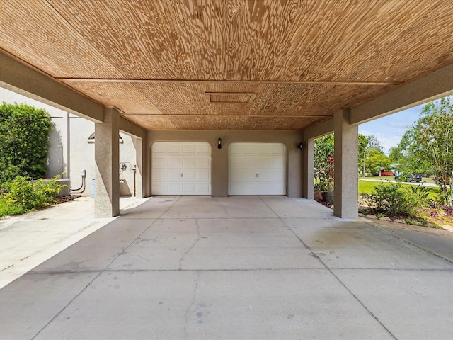 10318 Piper Dr, New Port Richey, FL 34654 - view of patio featuring a garage and driveway