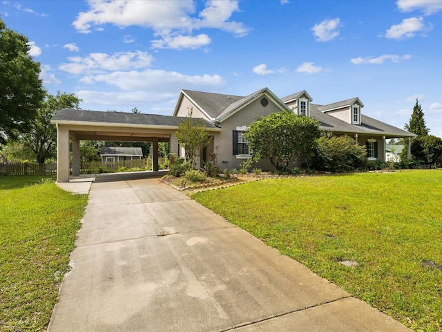 10318 Piper Dr, New Port Richey, FL 34654 - view of front of home with driveway, a carport, stucco siding, fence, and a front lawn