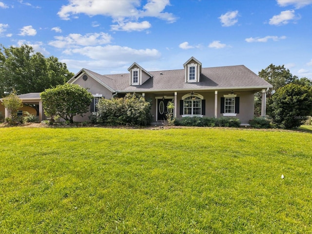 10318 Piper Dr, New Port Richey, FL 34654 - cape cod home with ceiling fan, a front lawn, and stucco siding