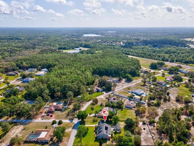 10318 Piper Dr, New Port Richey, FL 34654 - drone / aerial view featuring a residential view and a view of trees