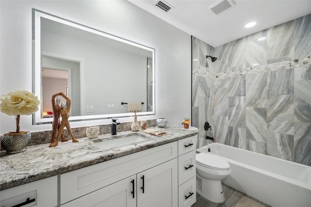 full bathroom featuring shower / bath combination, vanity, visible vents, and toilet