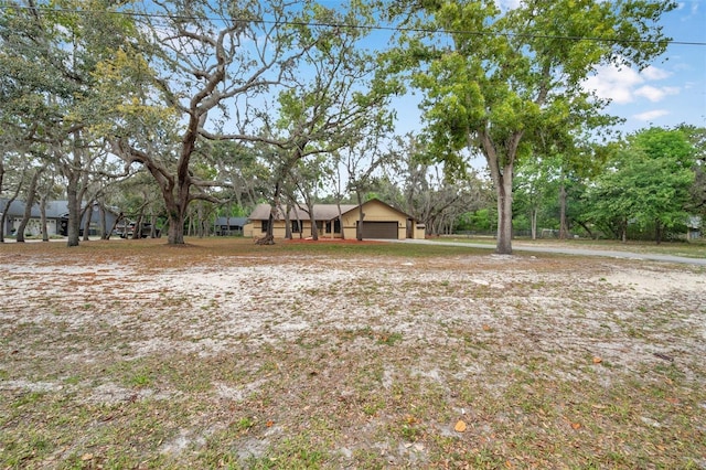 view of yard with an attached garage