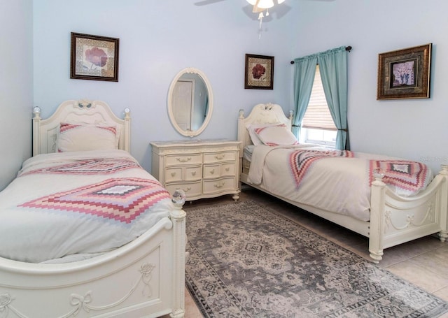 bedroom with tile patterned floors and a ceiling fan