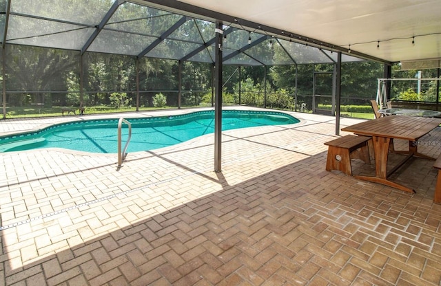 pool with a patio area and a lanai