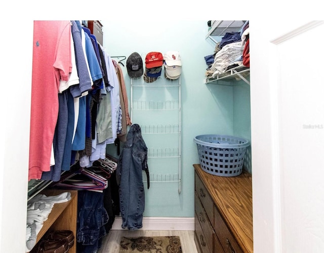 spacious closet with wood finished floors