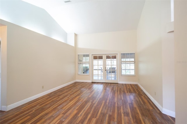unfurnished room featuring french doors, high vaulted ceiling, baseboards, and dark wood-style floors