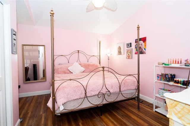 bedroom with wood finished floors, baseboards, and a ceiling fan