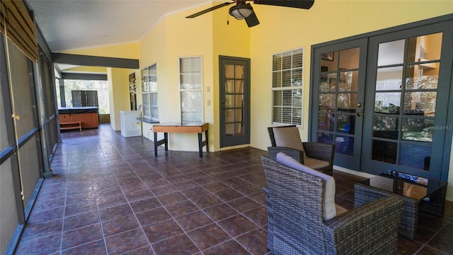 view of patio / terrace featuring french doors, ceiling fan, and a hot tub